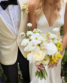 the bride and groom are posing for a photo