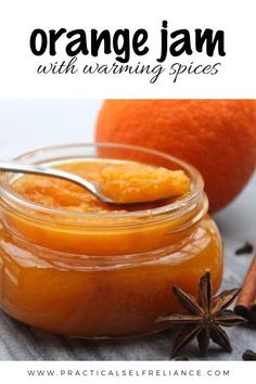 an orange jam in a glass jar with star anise on the side