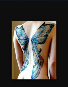 the back of a woman's body with butterfly tattoos on her upper and side