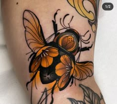 a bee tattoo on the arm and leg