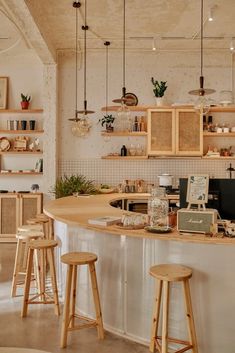 a kitchen filled with lots of wooden stools