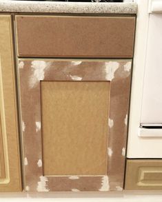 the kitchen cabinets are being painted brown and white