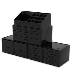 three black drawers stacked on top of each other with one drawer open and the other closed