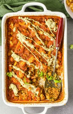 a casserole dish filled with meat and sauce