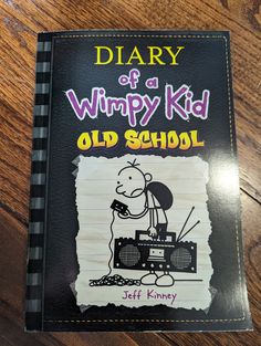 a book with the title diary of a wimpy kid old school written on it