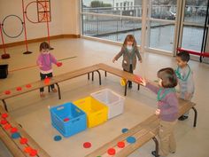 children playing with toys in an indoor play area