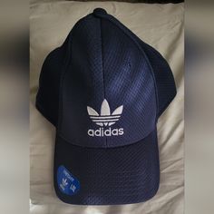 8xhp10-4-231-1-242-1-242-22-242-24-244-14-244-24-246-1-24nwt Mens Adidas Hat Navy Blue And White Size L/Xl That Has Never Been Worn Sporty Blue Hat With Curved Visor, Blue Breathable Six-panel Hat, Navy Visor Hat For Outdoor, Navy Outdoor Visor Hat, Blue Sports Hat, Blue Sporty Visor Fitted Hat, Sporty Blue Hat For Sports, Sporty Blue Fitted Hat For Sports, Sporty Navy Hats For Outdoor