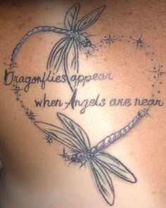 a woman with a dragonfly tattoo on her back and the words dragonflies appear to be when angels are navigating