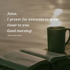 an open book and coffee cup on a dock with the words jesus, i prayer for everyone to draw closer to you, good morning