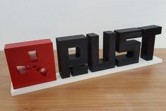 RUST game logo with text and support. Perfect gift for any Rust player and fan. Made on a 3D printer with PLA material. Painted with acrylic and coated with glossy varnish. If you want the text in white and the base in another color, you just have to ask for it. Fully customizable upon request. A perfect gift for any fan of the game rust. Choose your color: - Unpainted: completely white or black logo - Painted: Square logo in red, RUST letters in white or black depending on the chosen color. Approximate size: 220 x 50 x 15mm Rust Game, Pastel Home Decor, Square Logo, Pastel House, Game Logo, The Chosen, Gaming Gifts, Black Logo, 3d Printer