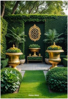 an outdoor garden with gold vases and green plants in the center, surrounded by greenery