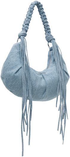 a blue purse with fringes hanging from it