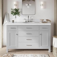 a white bathroom with two sinks and a large mirror above the sink is an area rug