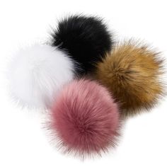 three different colored fur pom poms