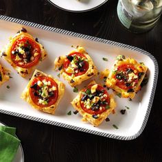 small appetizers are arranged on a serving platter, ready to be eaten