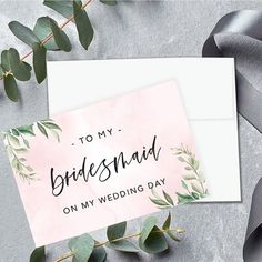 a card that says to my bridesmaid on my wedding day with greenery