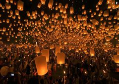 the words flash mob at my wedding are lit up with lanterns flying in the air