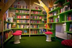 the children's library is filled with books and stuffed animals, including toad - like mushrooms