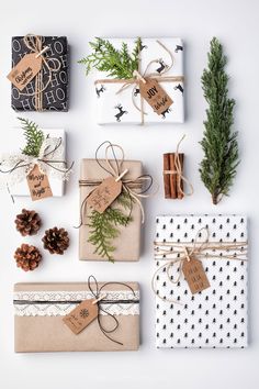 presents wrapped in brown paper and tied with twine, pine cones and evergreen branches