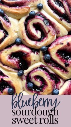 blueberry cinnamon rolls with icing and fresh blueberries on top