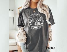 Comfort Colors, We Are The Granddaughters of The Witches You Couldn't Burn Shirt, Halloween Shirt, Spooky Shirt, Halloween Witch Shirt ** BAKC PRINT UPGARDE** https://www.etsy.com/listing/1754909686/back-print-additional-cost?ref=listings_manager_grid ❤ If you want this design in a different style or brand, please let us know. ❤ All items are custom made to order, we do not accept returns or exchanges. Feel free to contact us with any questions. ❤ Please carefully review the sizing details provided, as our t-shirts are unisex and not specifically tailored for women sizes. A Comfort Colors shirt is a type of casual t-shirt known for its softness, relaxed fit, muted color palette, and THICK cotton material. *6.1 oz./yd² (US), 10 oz/L yd (CA), 100% ring spun cotton, 30 singles *Garment dyed f Granddaughters Of The Witches, The Witches, Muted Color Palette, Halloween Witch, Halloween Shirt, Casual T Shirts, Comfort Colors, Different Styles, Cotton Material