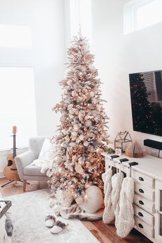 a white christmas tree in a living room