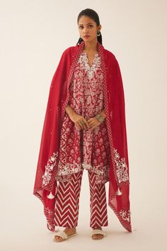 Red short kalidar kurta with bloom hand block print and sequin, bead, tassel embroidery on neckline and sleeve hem. Paired with cotton chevron hand block printed straight pant and silk chanderi dupatta with printed border on the edges.
Components: 3
Pattern: Hand Block Printed, Embroidery
Type Of Work: Bloom, chevron sequin, bead, tassel
Neckline: Notched
Sleeve Type: Three quarter
Fabric: Kurta and Dupatta: Silk Chanderi, Pant: Cotton
Color: Red
Other Details: 
Lined kurta
Elasticated waist at Kalidar Kurta, Kurta And Dupatta, Tassel Embroidery, Chanderi Dupatta, Red Kurta, Printed Embroidery, Kurta Patterns, Hand Block Print, Brocade Fabric