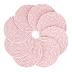 six pink round rugs on a white background with no one in the photo to describe