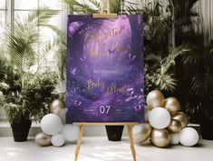 a purple and gold wedding sign in front of some white and gold balloons on an easel