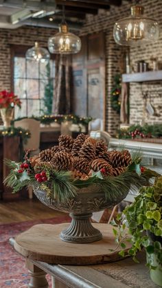 a large bowl filled with pine cones on top of a table next to a fireplace