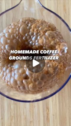 a glass bowl filled with food on top of a wooden table and the words homemade coffee grounds fertiizer