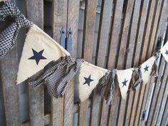 a wooden fence decorated with stars and burlocks