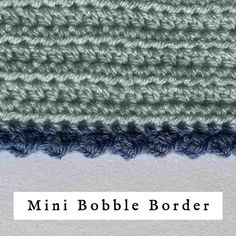 the crochet border is made up of blue and gray yarn