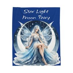 a blue towel with a fairy sitting on the moon in front of it's image