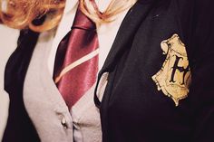 a woman wearing a harry potter tie and jacket