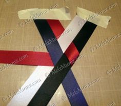 the ribbon is red, white, and blue with black stripes on it's side