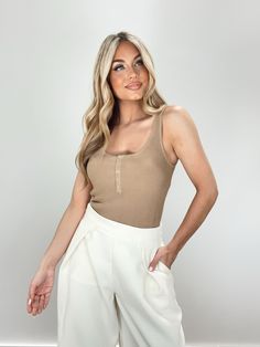 Introducing our Daylight Bodysuit - an elevated and chic essential for spring. Made from ribbed, soft, and stretchy material, with hidden snap closures and snap button details for a sleek and comfortable fit. Its thong design makes it perfect for layering, while its neutral and muted tones make it versatile for dinner or drinks. A must-have staple in any fashion-forward wardrobe. 73% Viscose 27% Nylon Hand wash cold separately. Muted Tones, Pine Green, Dresses Xs, Stretchy Material, Snap Button, Make It, Fashion Forward, Layering, Comfort Fit