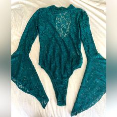 Fashion Nova- Green Lace (See Through) Bodysuit With Long Bell Sleeves Cut Out Back. Size Medium- Never Worn Green Lace Bodysuit, Long Sleeve Lace Bodysuit For Party, Elegant Green Long Sleeve Bodysuit, Elegant Long Sleeve Green Bodysuit, Green Stretch Bodysuit For Party, Green Fitted Bodysuit For Party, Chic Green Bodysuit For Party, Elegant Green Stretch Bodysuit, Fitted Green Bodysuit For Night Out