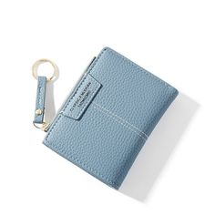 a blue wallet with a keychain attached to it and a card holder in the front