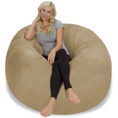 a woman sitting on a bean bag chair