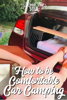 a woman sitting in the back of a car with her feet propped up on a table