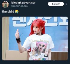 a girl with red hair is standing in front of a t - shirt that says, i'm pink advertiser @ the shirt