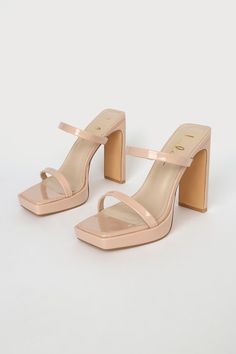 Who wouldn't be completely obsessed with the Lulus Fausee Light Nude Patent Square Toe Platform Slide Sandals! Sleek patent faux leather shapes these heels with a trendy square footbed (with a 0.5"" toe platform), a slender toe strap, and a matching vamp strap with a bit of elastic at the side. An easy-to-slide-on design tops a sky-high blade heel for a chic look! 4. 5" wrapped heel. Cushioned insole. Rubber sole has nonskid markings. All Man Made Materials. Imported. Lulus | Fausee Light Nude P Summer Patent Leather Block Heels, Trendy Patent Leather Block Heels For Summer, Trendy Summer Patent Leather Block Heels, Trendy Patent Leather Block Heels, Trendy Patent Leather Block Heels For Spring, Square Toe Patent Leather Platform Heels, Trendy Patent Leather Sandals With Block Heel, Summer Patent Leather Block Heels With Sculpted Heel, Summer Patent Leather Block Heels With Stacked Heel