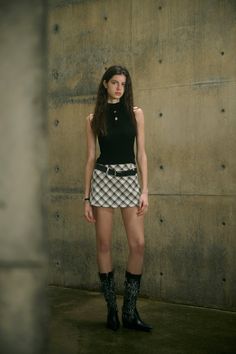 Checkered print Invisible side zipper Removable belt Micro mini length This checkered mini skirt blends a classic print with a micro mini length, creating an on-trend and stylishly eye-catching vibe. The timeless pattern adds a touch of sophistication to its daring length, making it a fashion-forward choice for your summer wardrobe.