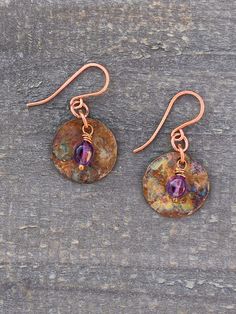 "Playing with fire! These colorful copper earrings have a beautiful hammered texture, and they have been painted with fire which adds a stunning colorful design to them. Accented with an amethyst bead, they are a great gift idea for February birthdays. Get 10% off orders over $50! Combine any orders over $50 from my shop and use discount code Smiles10 at checkout. Make sure you apply this code at checkout as it it not retroactive. They are totally unique, as no two are ever exactly alike, even w Playing With Fire, 7th Wedding Anniversary, Great Anniversary Gifts, Birthstone Earrings, Mesa Az, Amethyst Beads, Birthstone Earring, Amethyst Earrings, Copper Earrings