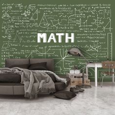 a room with a bed, desk and chalkboard wallpaper that says math on it