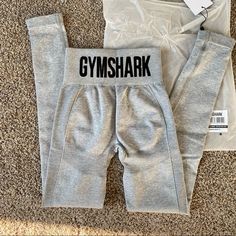 Gymshark Flex High Waisted Leggings Light Grey Marl / Black Extra Small Xs Nwt And New With Bag Fitted Gray Activewear For Loungewear, Fitted Gym Bottoms With Letter Print, Gray Fitted Sporty Bottoms, Gray Athleisure Pants With Letter Print, Gray Letter Print Athleisure Pants, Stretch Gray Activewear With Letter Print, Gray Fitted Gym Leggings, Gray Fitted Leggings For Gym, Gymshark Flex Leggings