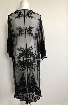 "Bohemian style sheer lace cardigan features a tie front and kimono style in a relaxed fit. It's beautifully made in delicate embroidered sheer lace all over. Can be dressed down or dress up -- made a romantic cover up for a summer night outing, a party, or just to the beach! ONE SIZE FITS MOST - SMALL, MEDIUM LARGE Length: 44\" Bust: 20\" (tie front, one size fits all) Sleeve length: 17\" Armhole : 11\"" Fitted Lace Cover-up With Lace Trim, Sheer Lace Cover-up For Spring, Bohemian Lace Patchwork Top, Festival Open Front Cover-up, Long Festival Cover-up With Lace Trim, Bohemian Fitted Sheer Cover-up, Spring Lace Cover-up With Lace Trim, Summer Lace Open Front Kimono, Long Lace Trim Cover-up For Festivals