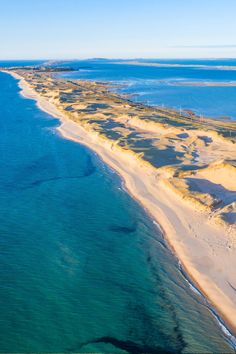 an aerial view of the beach and ocean