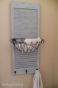 a towel rack hanging on the side of a wall